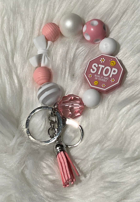 Pink and white self care wristlet key chain